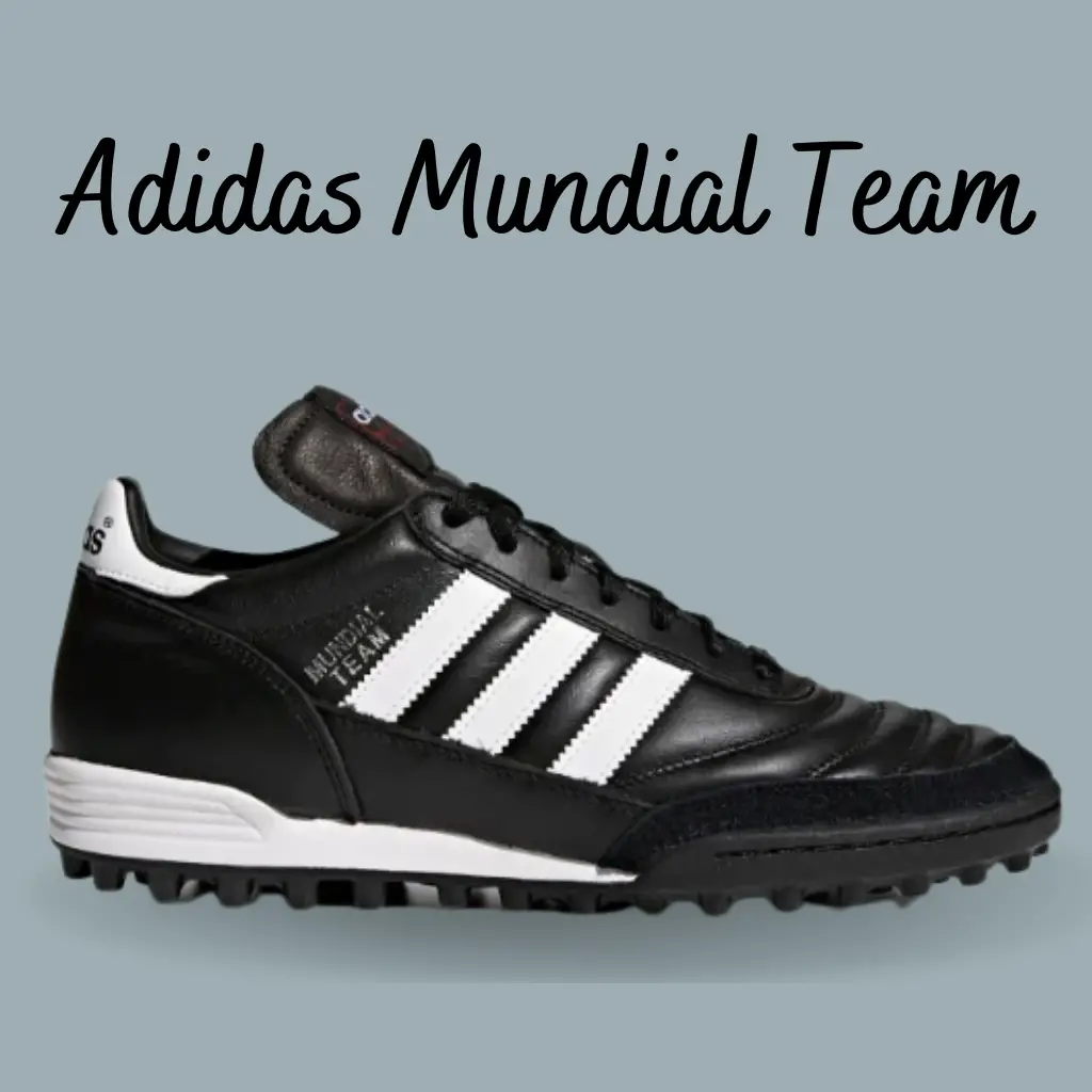 a black and white adidas mundial team turf soccer shoe