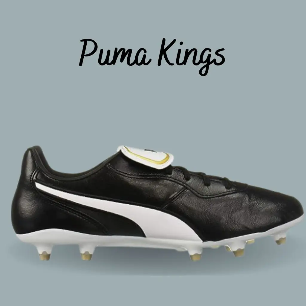 a black and white puma king cleat